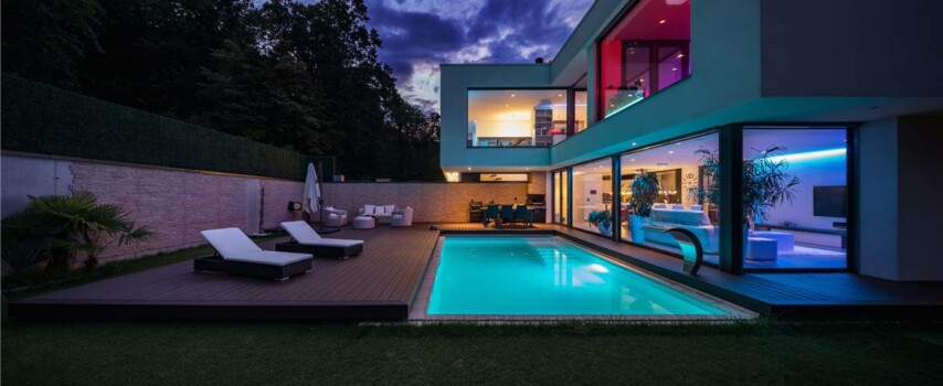 Modern villa with colored led lights at night. Nobody inside