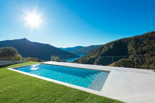 Swimming pool with lake and valley view
